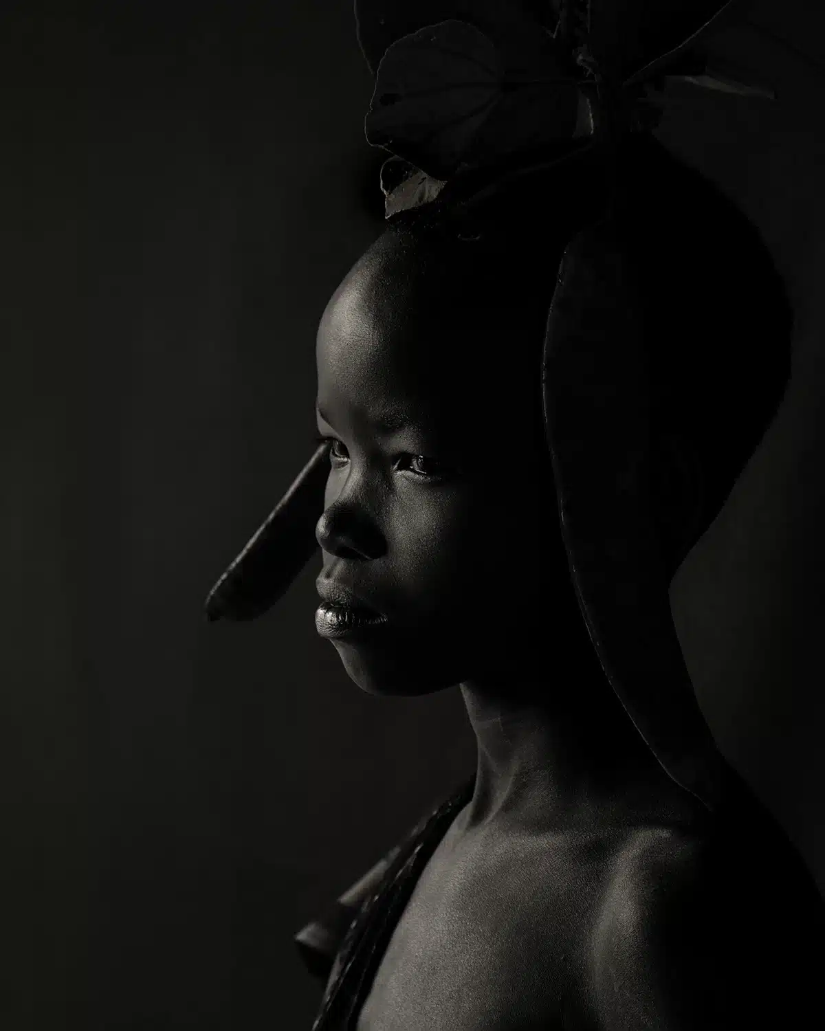 Black and white portrait of a member of Surma Tribe of the Omo Valley in Ethiopia