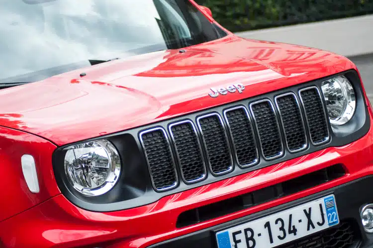 Front view of red jeep parked in the street