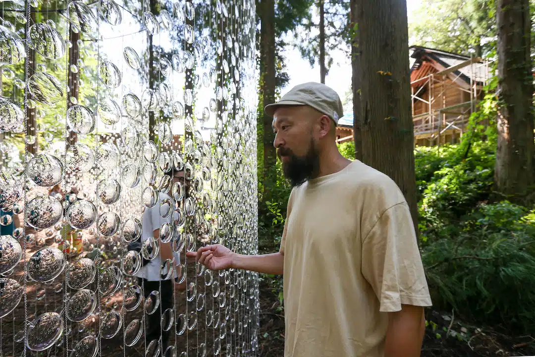 "A Whisper in the Eye of the Storm" by Caitlind r.c. Brown and Wayne Garrett, which uses 14,000 prescription lenses to create what looks like suspended rain drops.