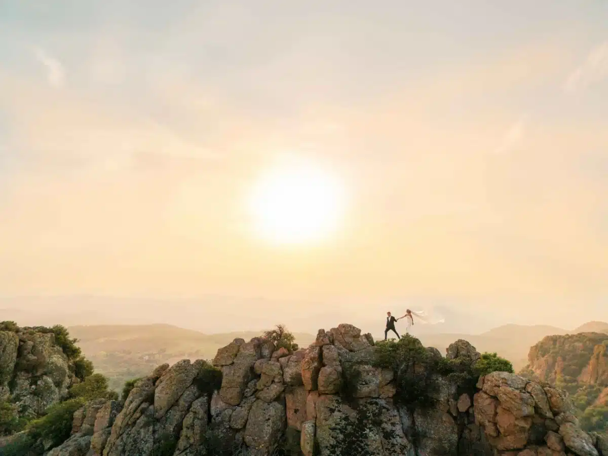 Bride and groom walking the summit of Roquebrune rock