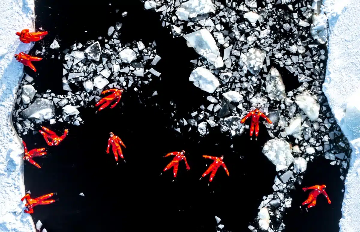 Adventurers Floating in Icy Water