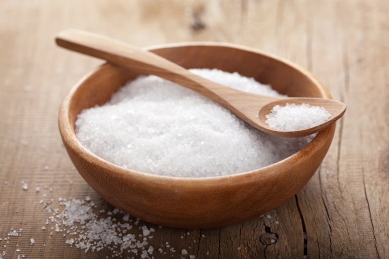 Bowl of salt with spoon on top