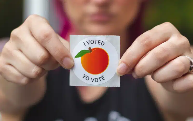 A Georgia voter displays her "I Voted" sticker after voting in the 2020 Presidential Election