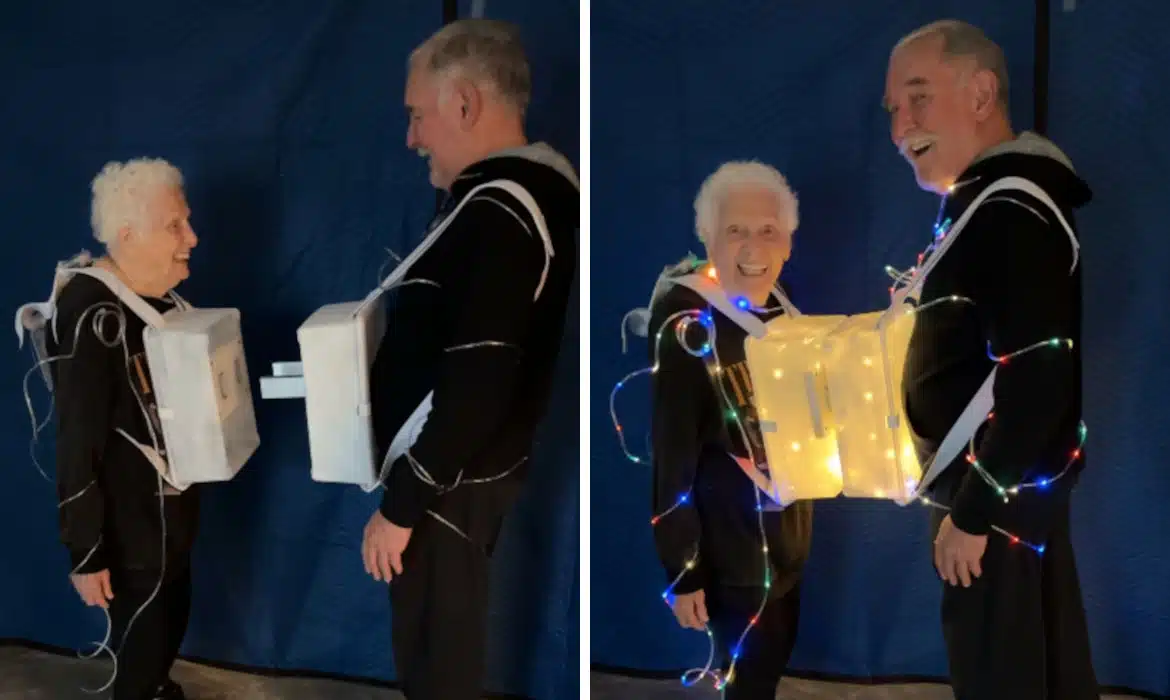 Granny and partner showing off their plug and socket costume