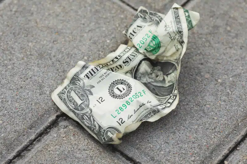 Dollar bill on the ground