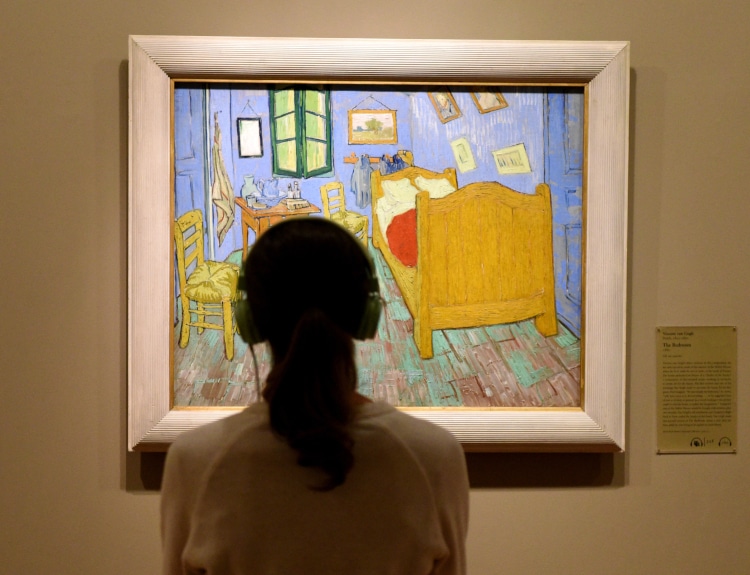 Woman looking at Van Gogh painting