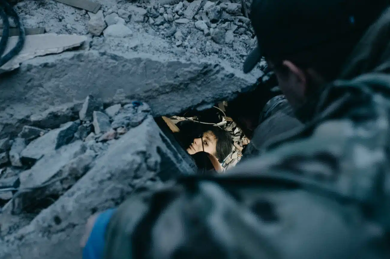 Amidst the chaos in Kramatorsk, Donetsk Region, Irina, a waitress at Ria Pizza, becomes trapped under rubble after a devastating Russian Iskander K missile