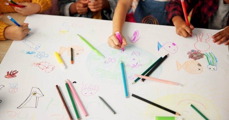 Teacher lets students draw on fabric for dress