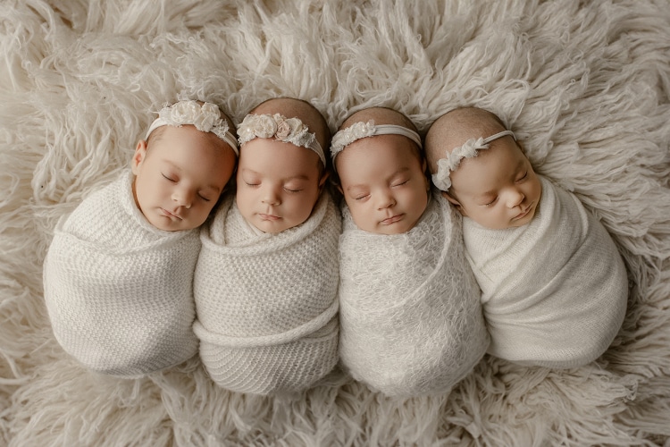 Baby quadruplets bundled up