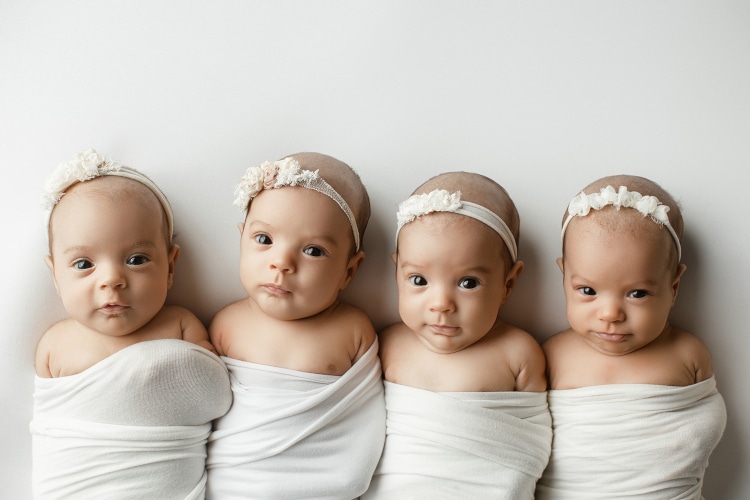 Baby quadruplets bundled up