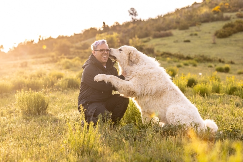 Craig Turner Bullock with a Great Pyrenees Dog