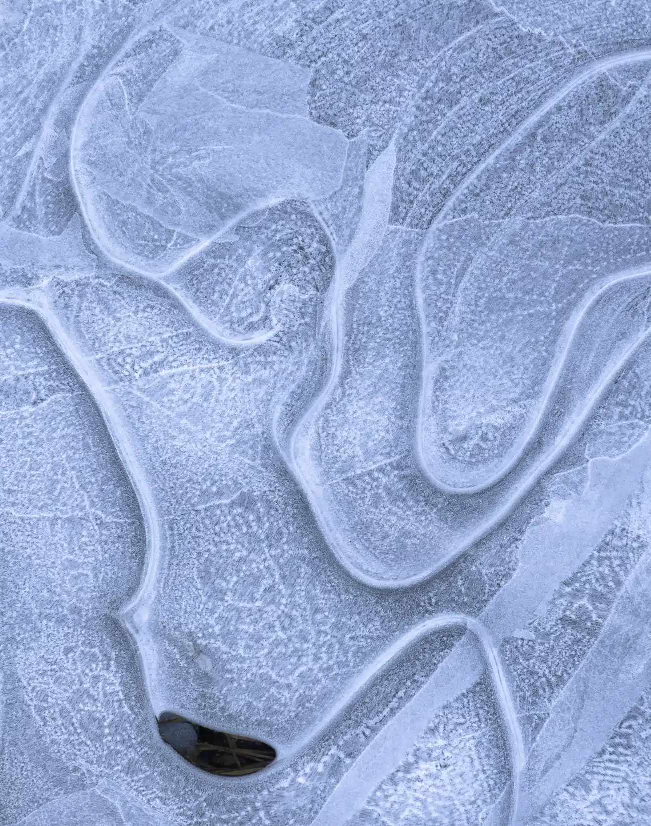 Thin Ditch of Ice Along a Country Road