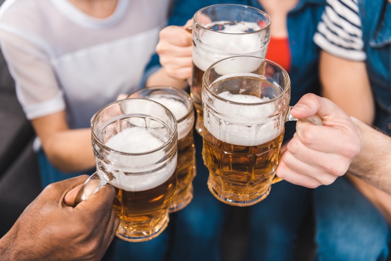 Group of people cheering with beer