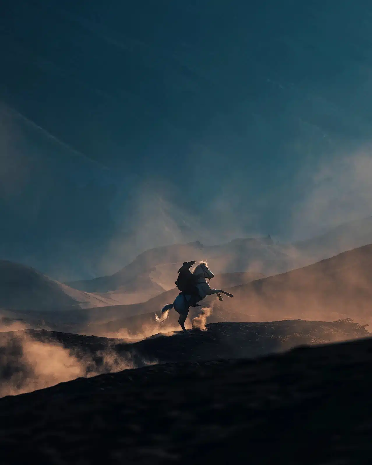 Horseman of Bromo with volcano in the background