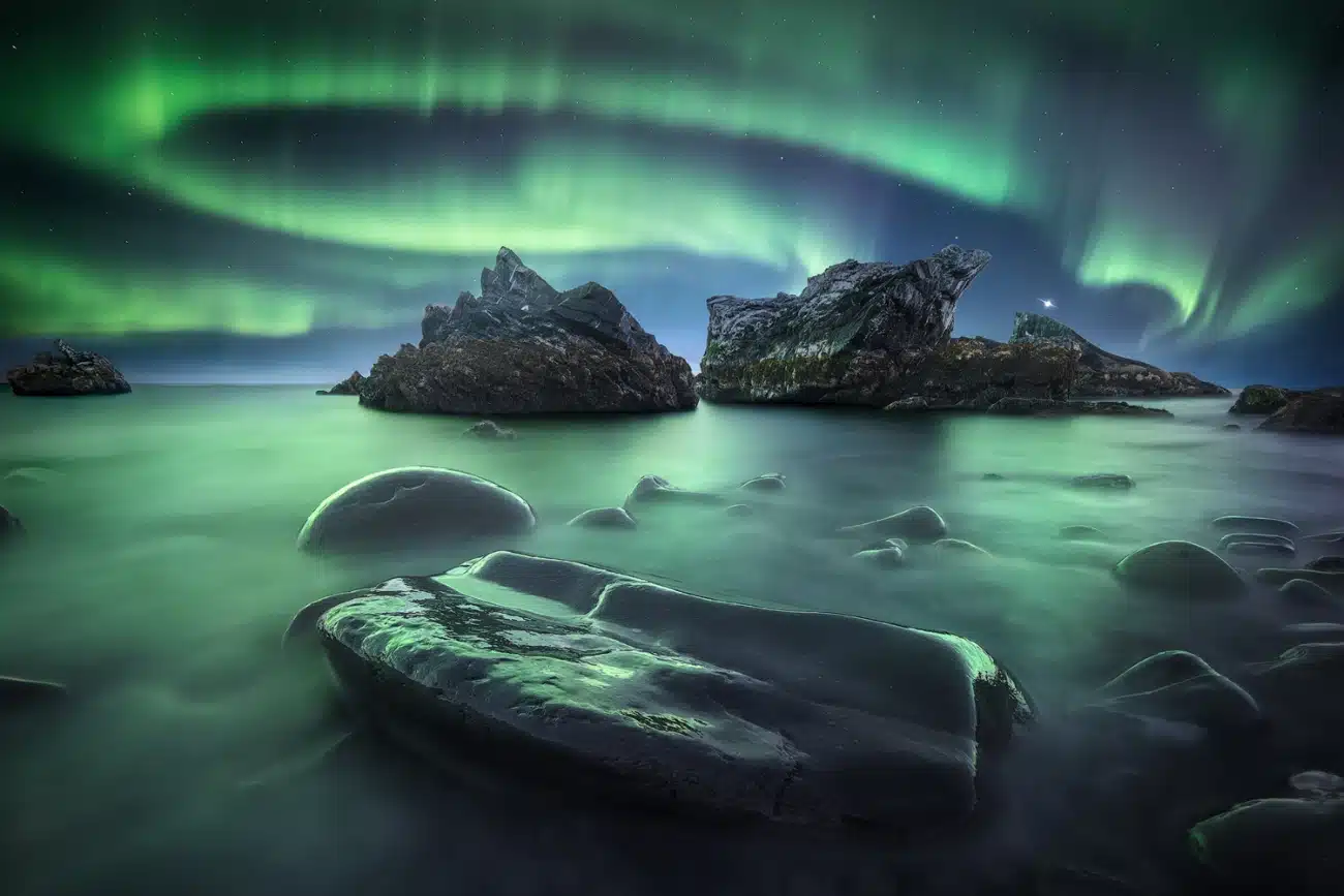 Northern Lights over ice on Rybachy Peninsula, Russia