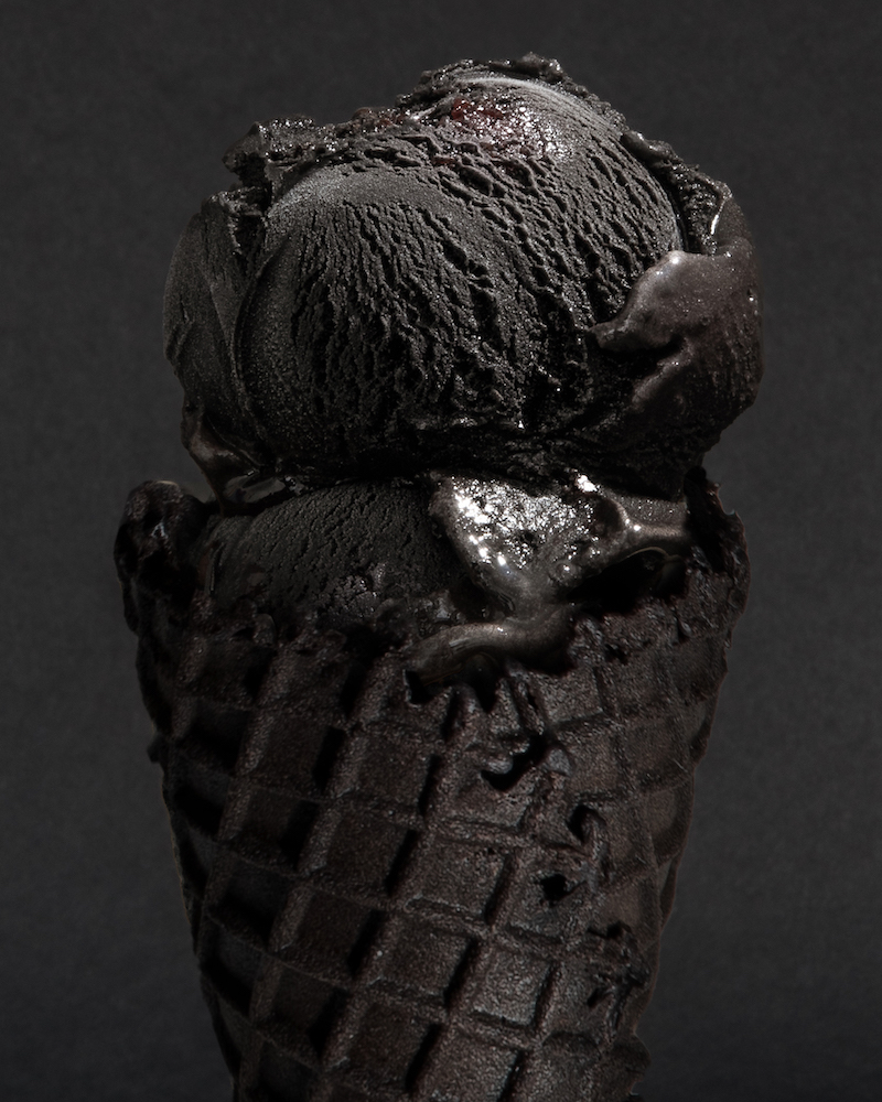 A black cone with the OPAQUE ice cream by Cj Hendry