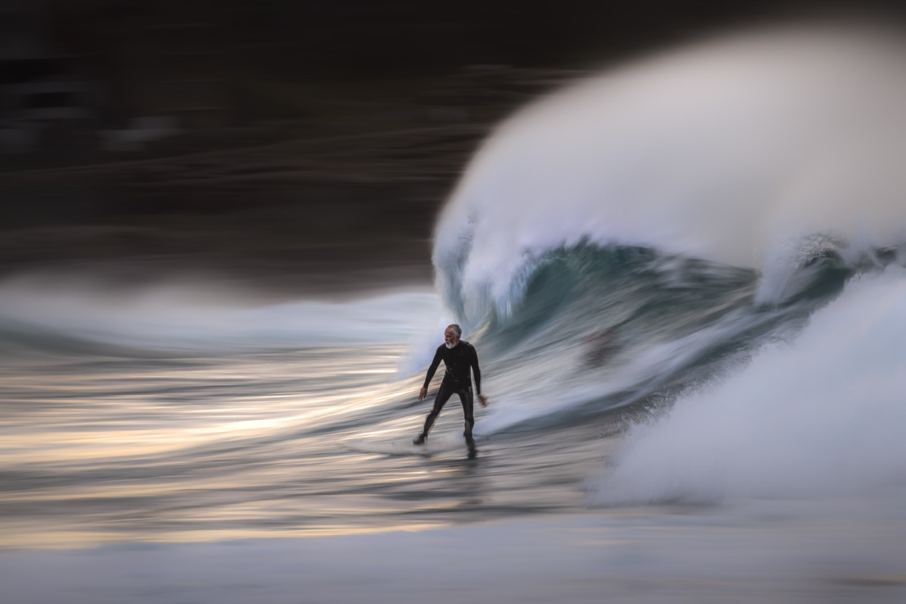 A surfer enjoys a crisp winter morning at Bronte Beach