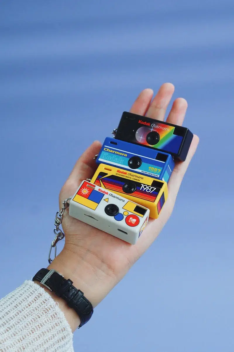 A group of Kodak Charmeras in someone's hand