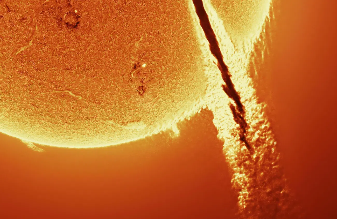 Sun with a rocket in front of it by Andrew McCarthy