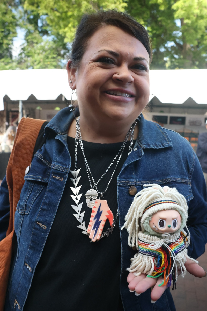 Jamie Powell with Labubu in Chilkat attire