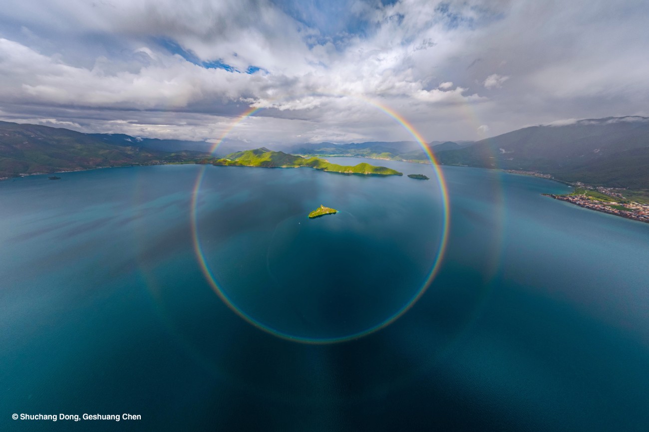 Circular rainbow over lake in China