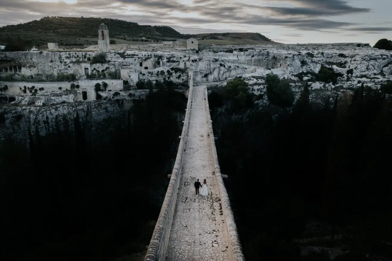 Couple on a bridge crossing a ravine