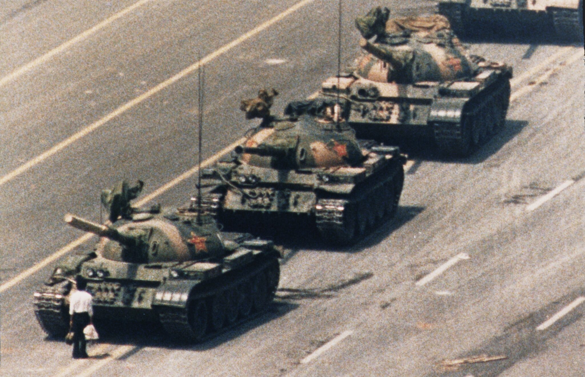 Charlie Cole, 1989. A demonstrator confronts a line of People's Liberation Army tanks on Chang'an Avenue, Beijing, during protests for democratic reform on Tiananmen Square.