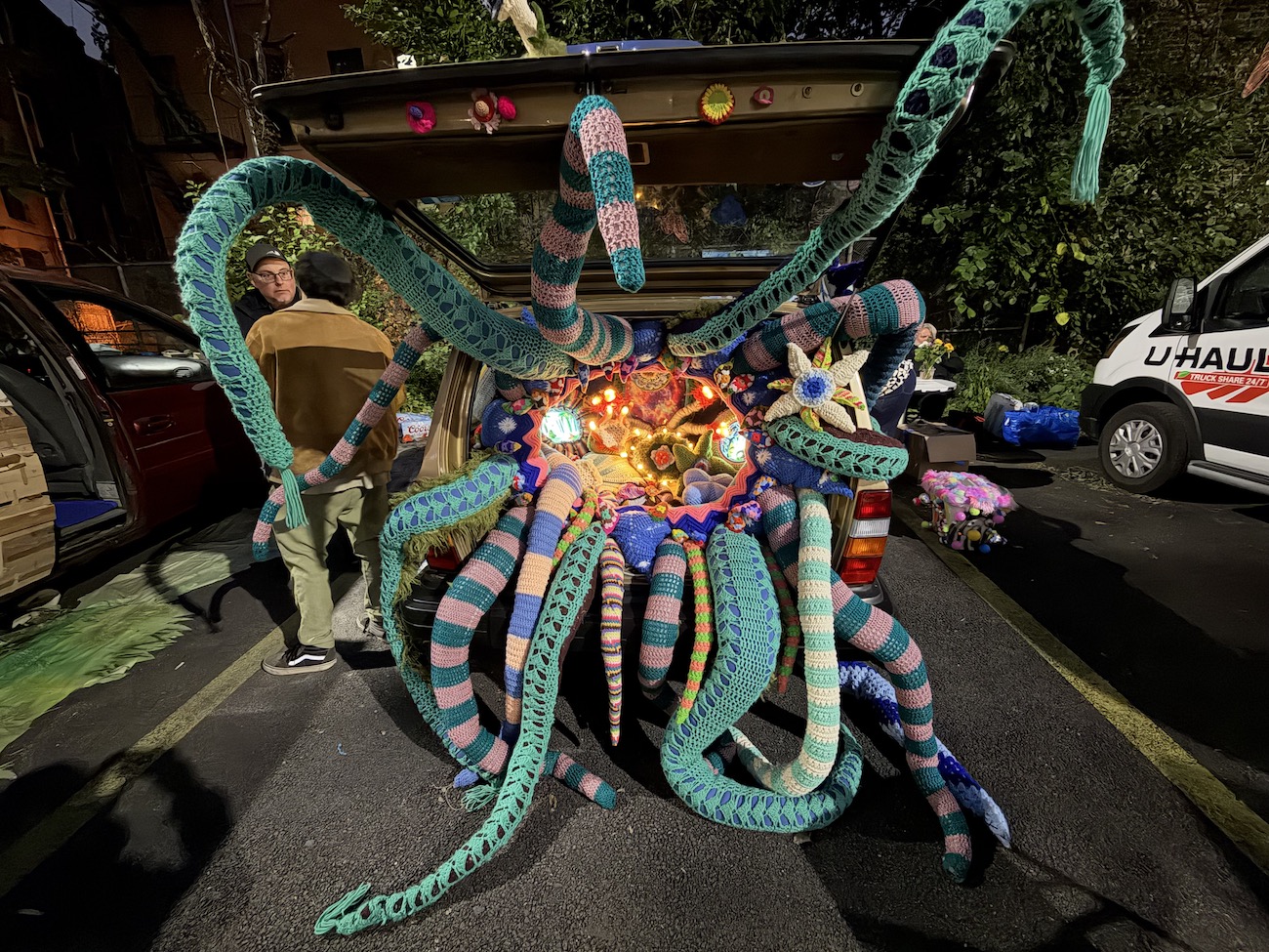 Jelia Gueramian’s installation inside a trunk, photographed at night.