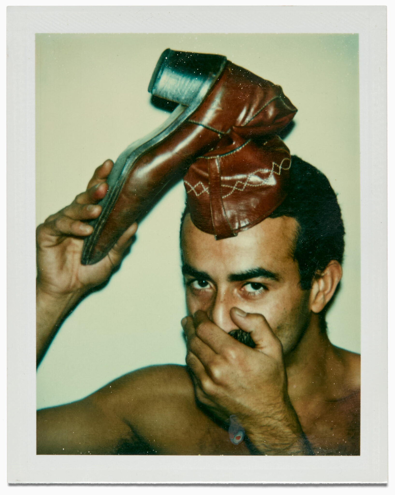 Andy Warhol, “Victor Hugo and Boot,” 1977. Polacolor Type 108, 4 1/4" x 3 3/8". © 2025 The Andy Warhol Foundation for the Visual Arts, Inc. and Licensed by Artists Rights Society (ARS), New York.