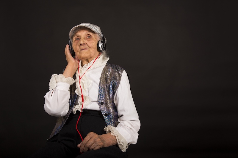Old Woman Listening to Music