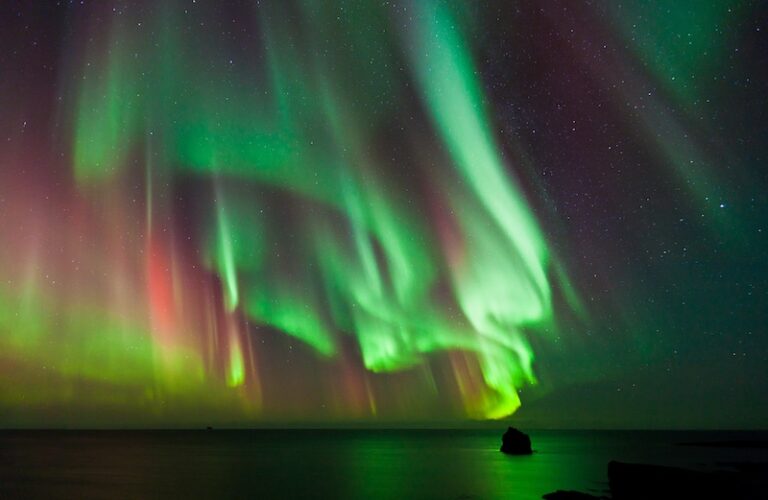Traveler Captures Northern Lights From Airplane Window