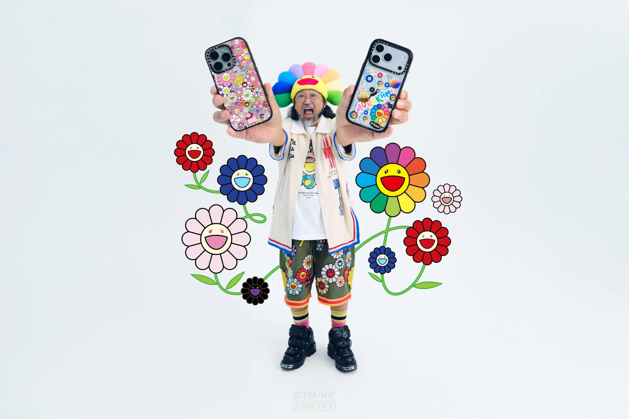 Takashi Murakami with products featured in his “Flowers Bloom” limited-edition collaboration with CASETiFY