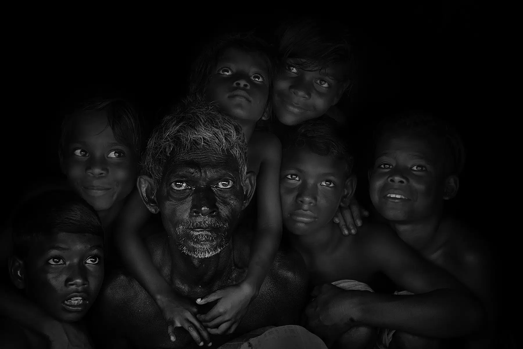 Asok Sengupta, “Ageless Portrait.” Overall winner, 2nd Place, Non-Professional, in the 2025 Black & White Photo Contest, as part of the reFocus Awards. “This is an outdoor shot, depicting the relation between the old and young,” Sengupta says.