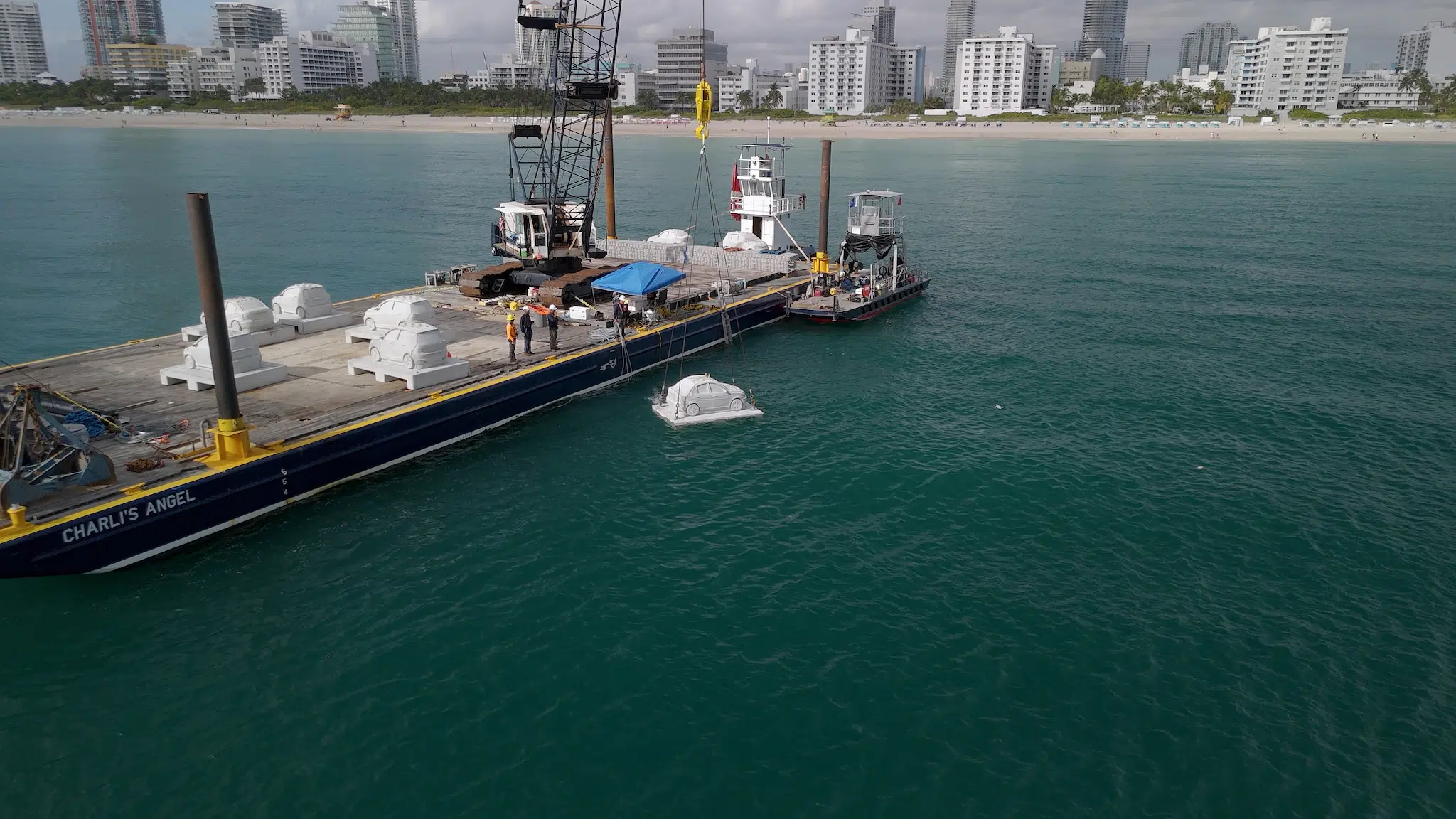 Preparing to submerge &ldquo;Concrete Coral,&rdquo; 2025, subaquatic installation featuring 22 concrete cars