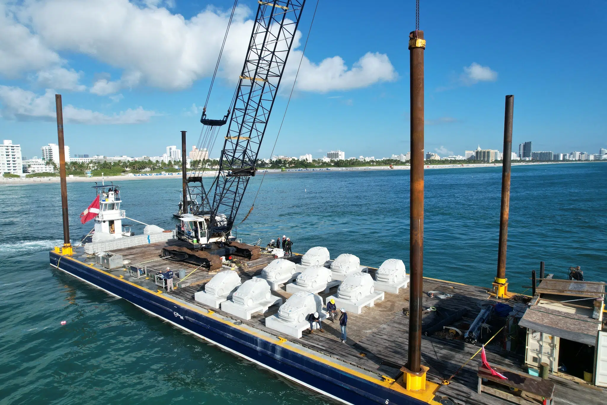 Preparing to submerge &ldquo;Concrete Coral,&rdquo; 2025, subaquatic installation featuring 22 concrete cars