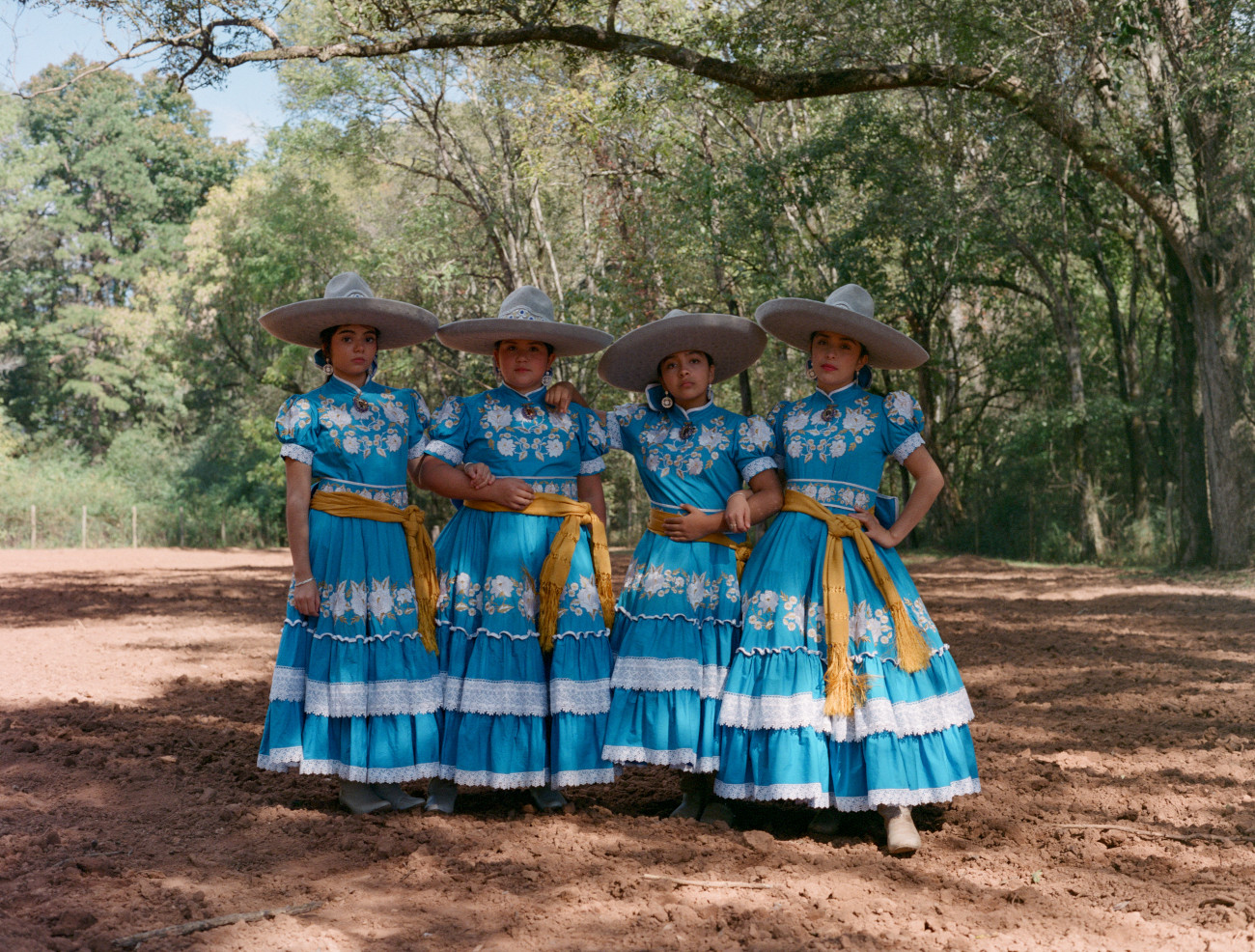 Mexican female horse riders in traditional attire for Escaramuza