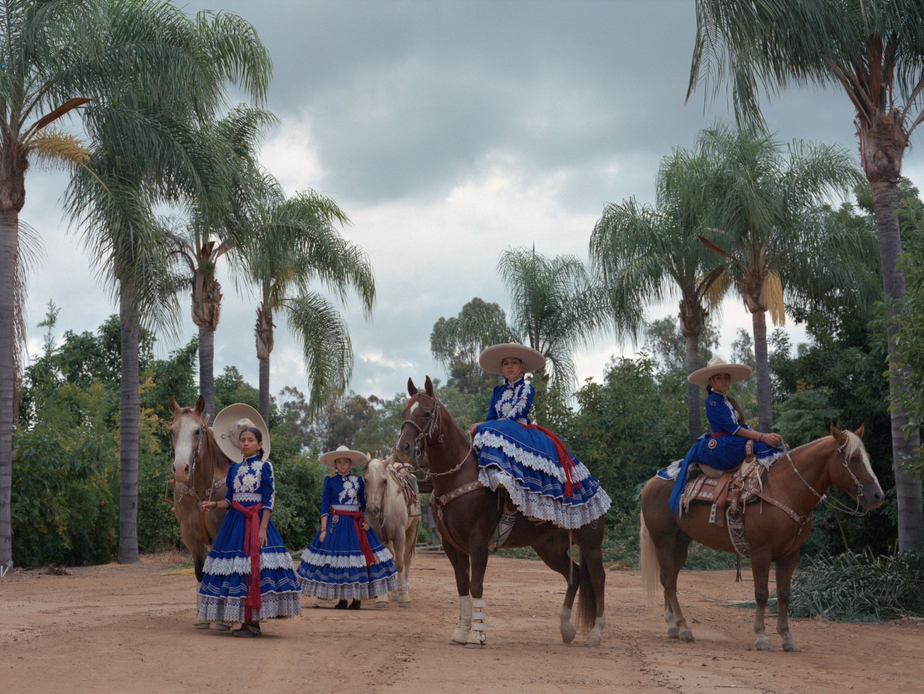 Mexican female horse riders in traditional attire for Escaramuza