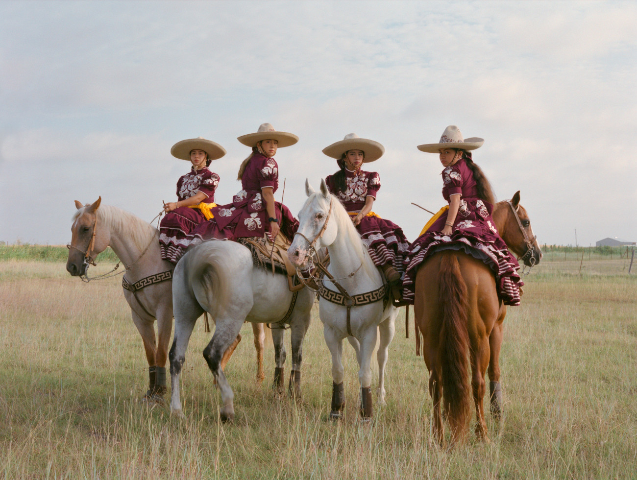 Mexican female horse riders in traditional attire for Escaramuza