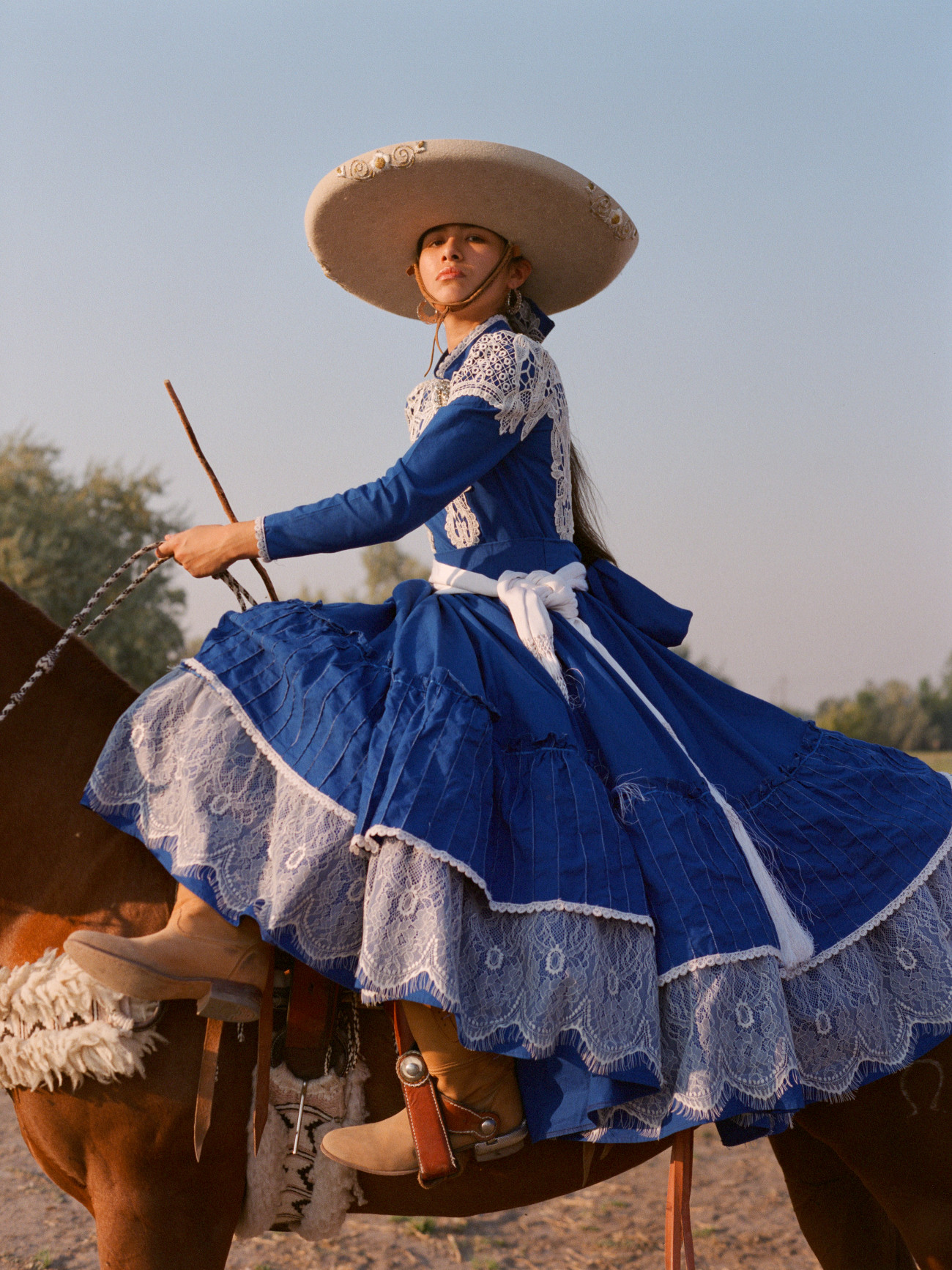 Mexican female horse rider in traditional attire for Escaramuza
