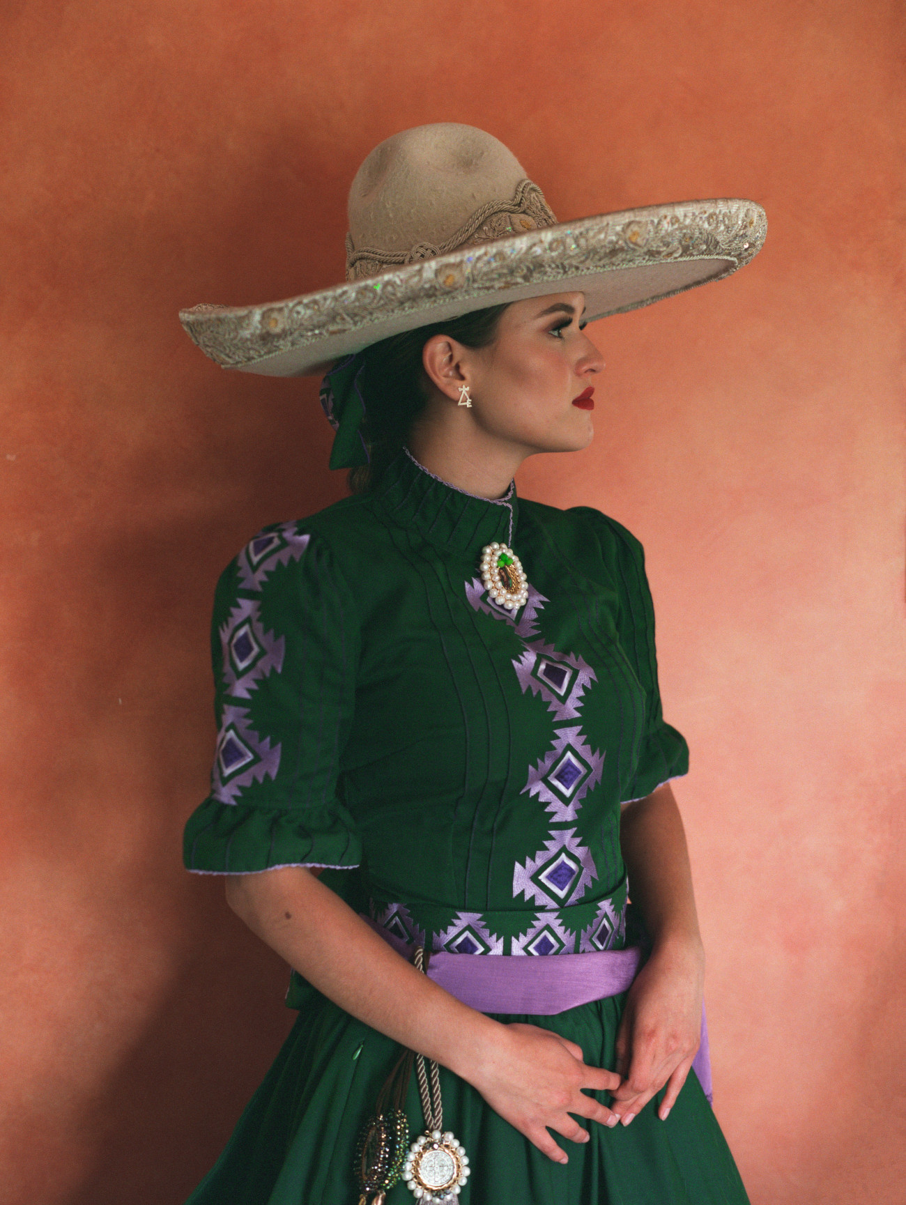 Mexican female horse rider in traditional attire for Escaramuza