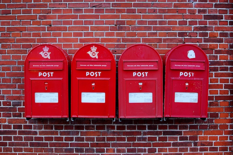 4 red mailboxes in a row