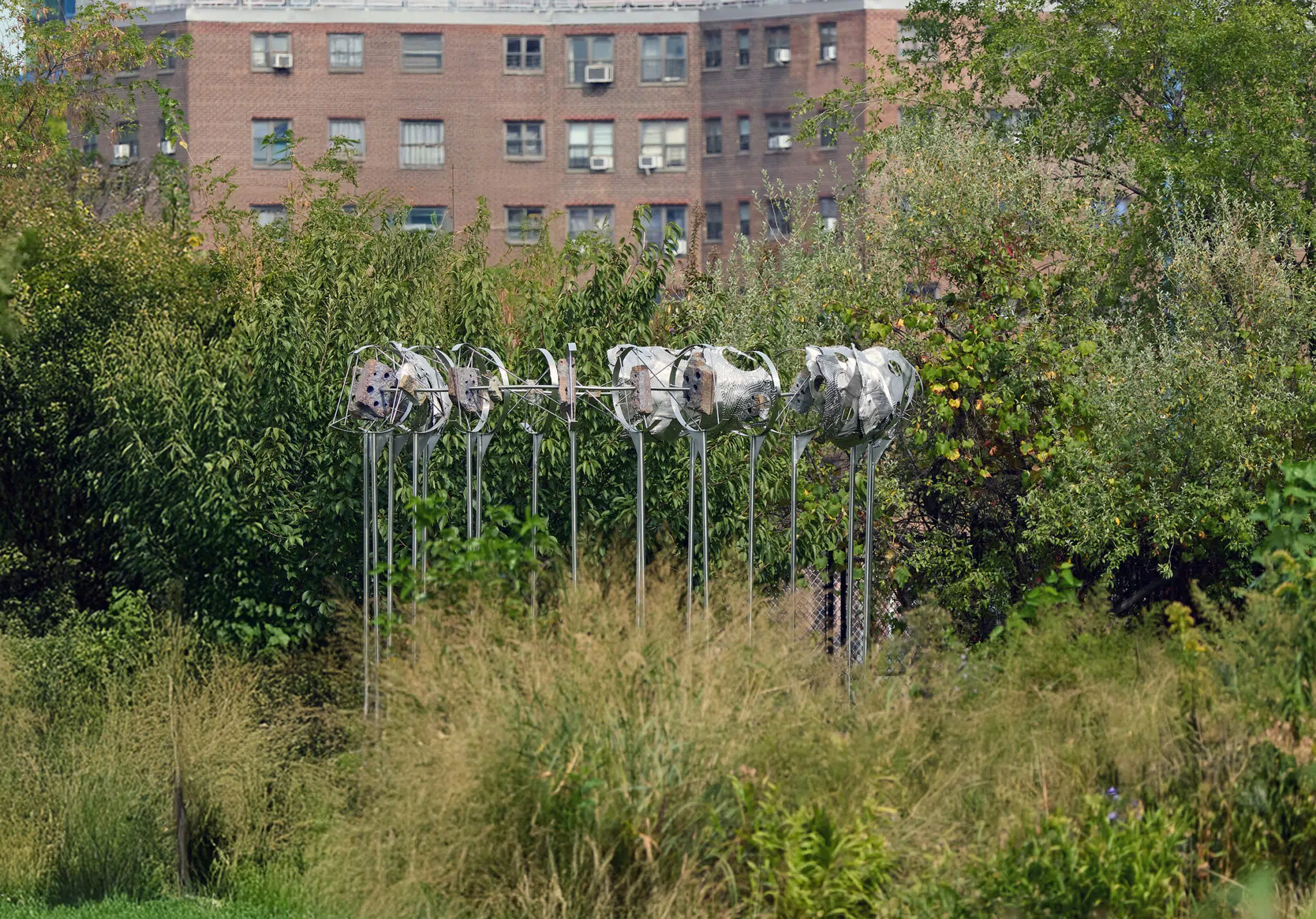 &lsquo;Cradlers,&rsquo; 2025. Stainless steel, mild steel, fossiliferous limestone blocks, compressed post-consumer stainless steel, stainless steel hardware. (Photo: Argenis Apolinario)