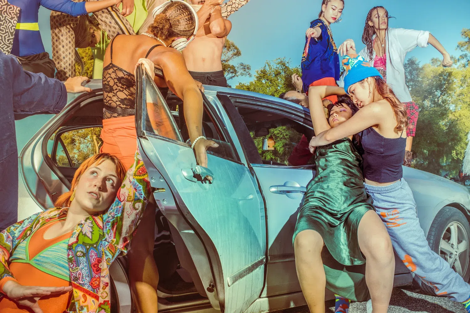 Dance photograph captured by Josh S. Rose, featuring a group of dancers beside a blue car