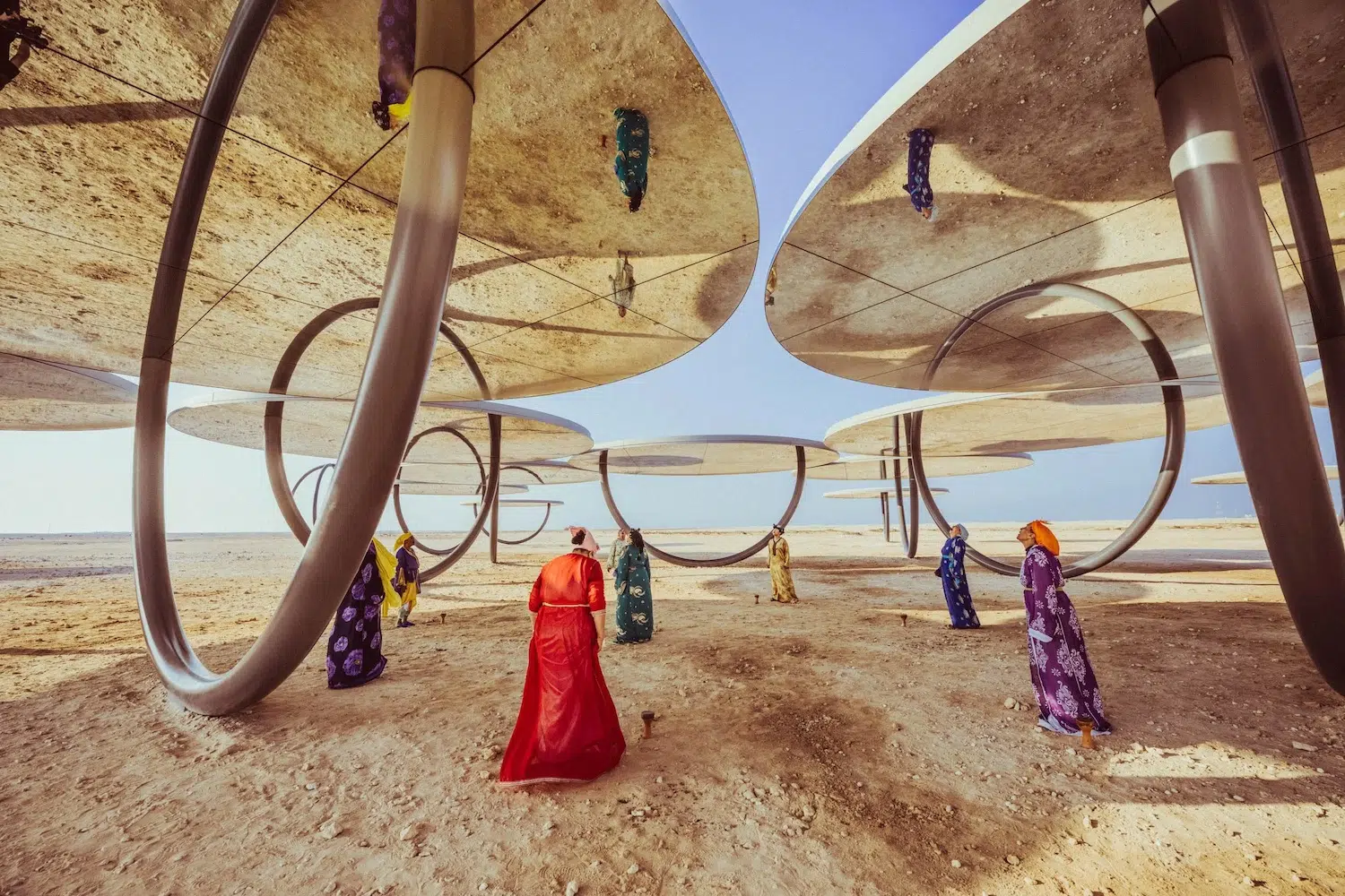 Dance photograph captured by Josh S. Rose, featuring a group of people below an art installation