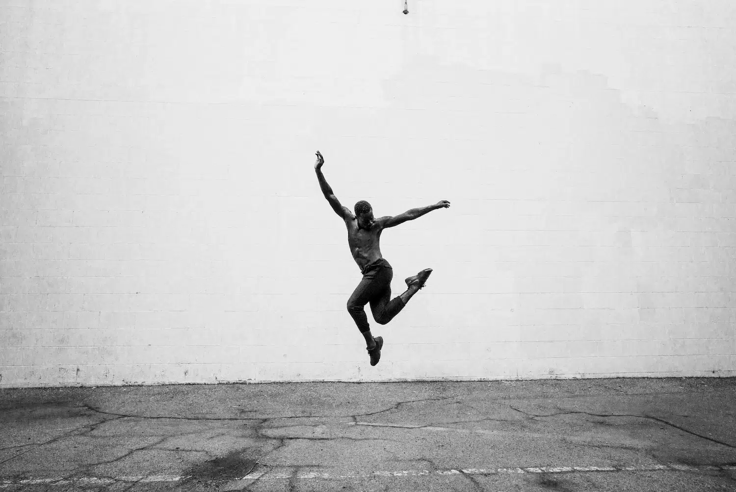 Dance photograph captured by Josh S. Rose, featuring a dancer jumping into the air