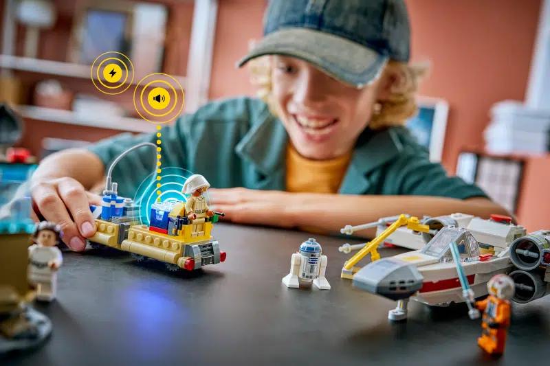 Kid playing with LEGO Star Wars set powered with Smart Play