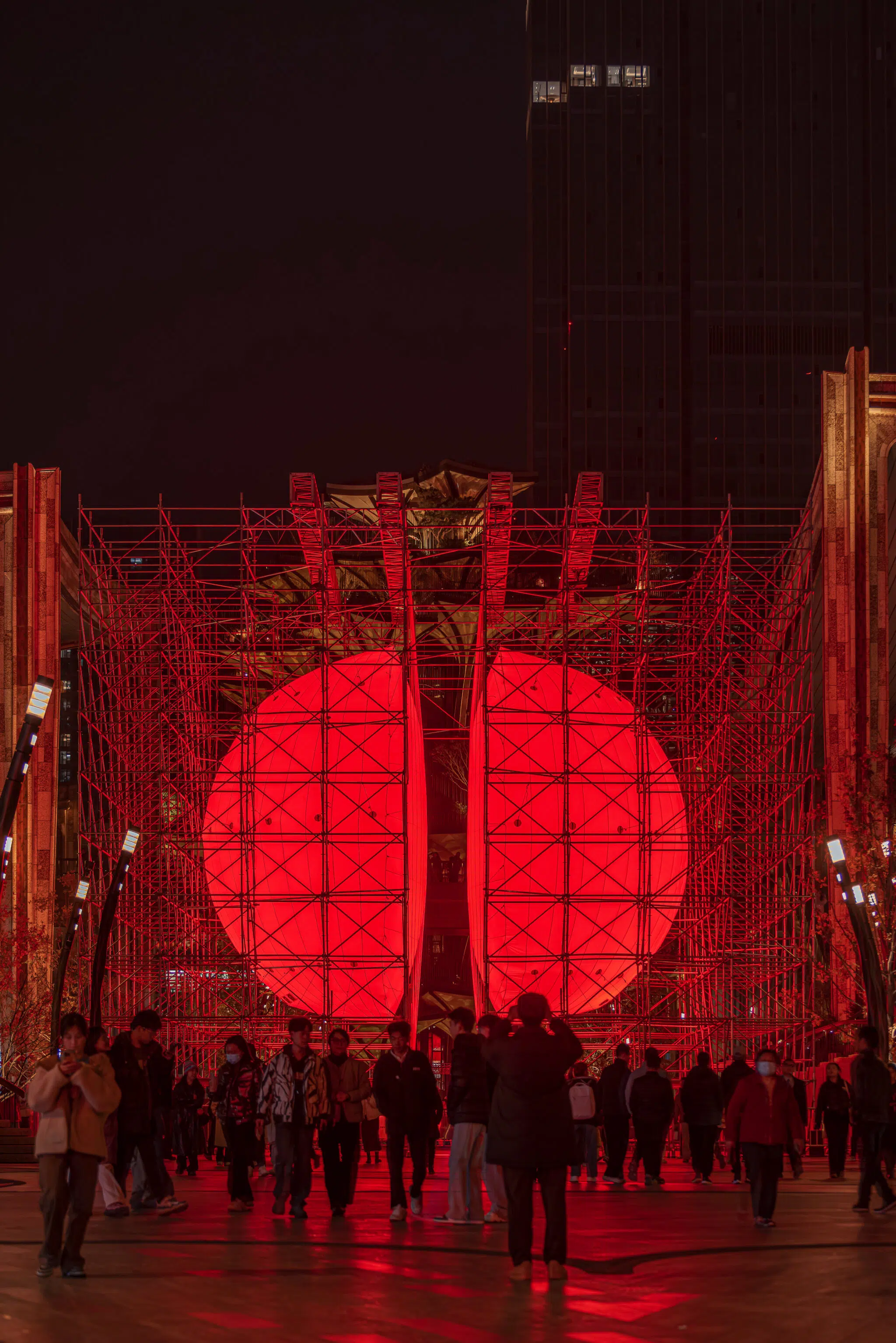 Installation view of SpY&rsquo;s &lsquo;Divided&rsquo; installation in Xi'an, China, composed of a monumental, illuminated red sphere