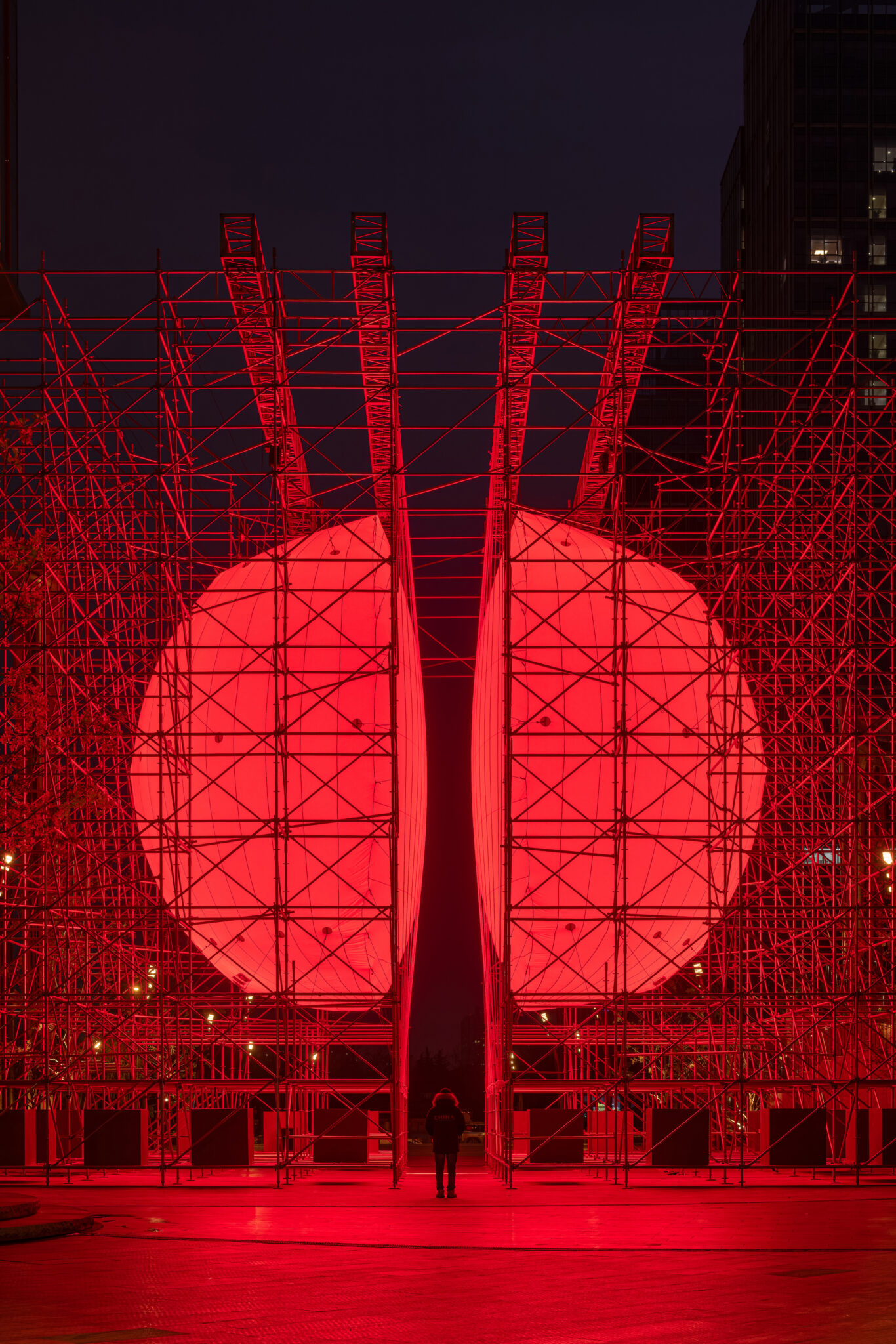 Installation view of SpY&rsquo;s &lsquo;Divided&rsquo; installation in Xi'an, China, composed of a monumental, illuminated red sphere