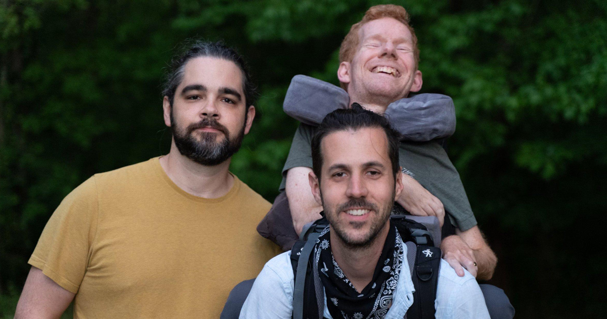 Friends Carry Their Buddy on Their Backs To Help Him See the World