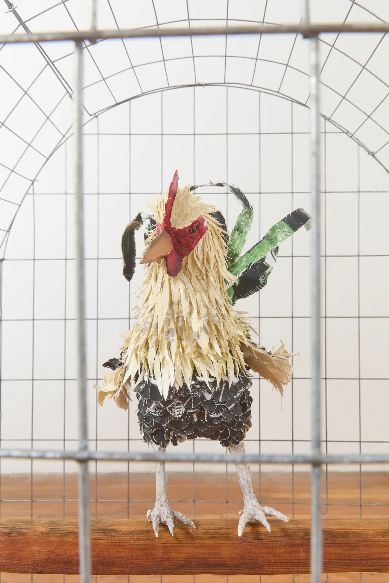 Yulissa Mendoza "3 Gallos por Acre 2," 2025 Wood, collaged photographs, steel wire, hay, and sound, 58 x 40 x 41 in.